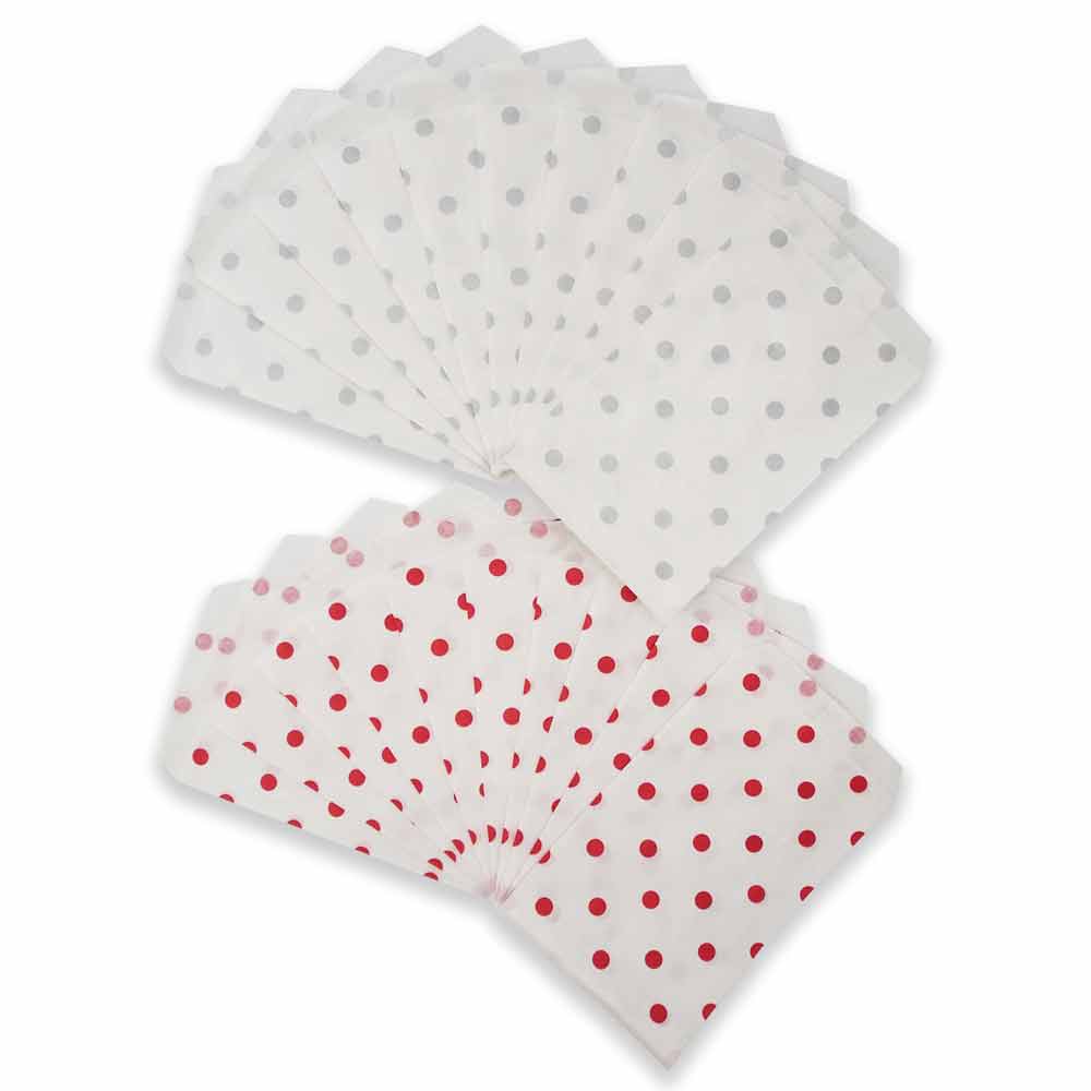 Silver or grey polka dot pattern on white flat paper bags, spread out in a fan shaped display